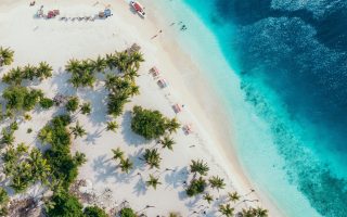 Wat kun je combineren met een strandlaken als cadeau?