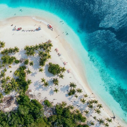 Wat kun je combineren met een strandlaken als cadeau?